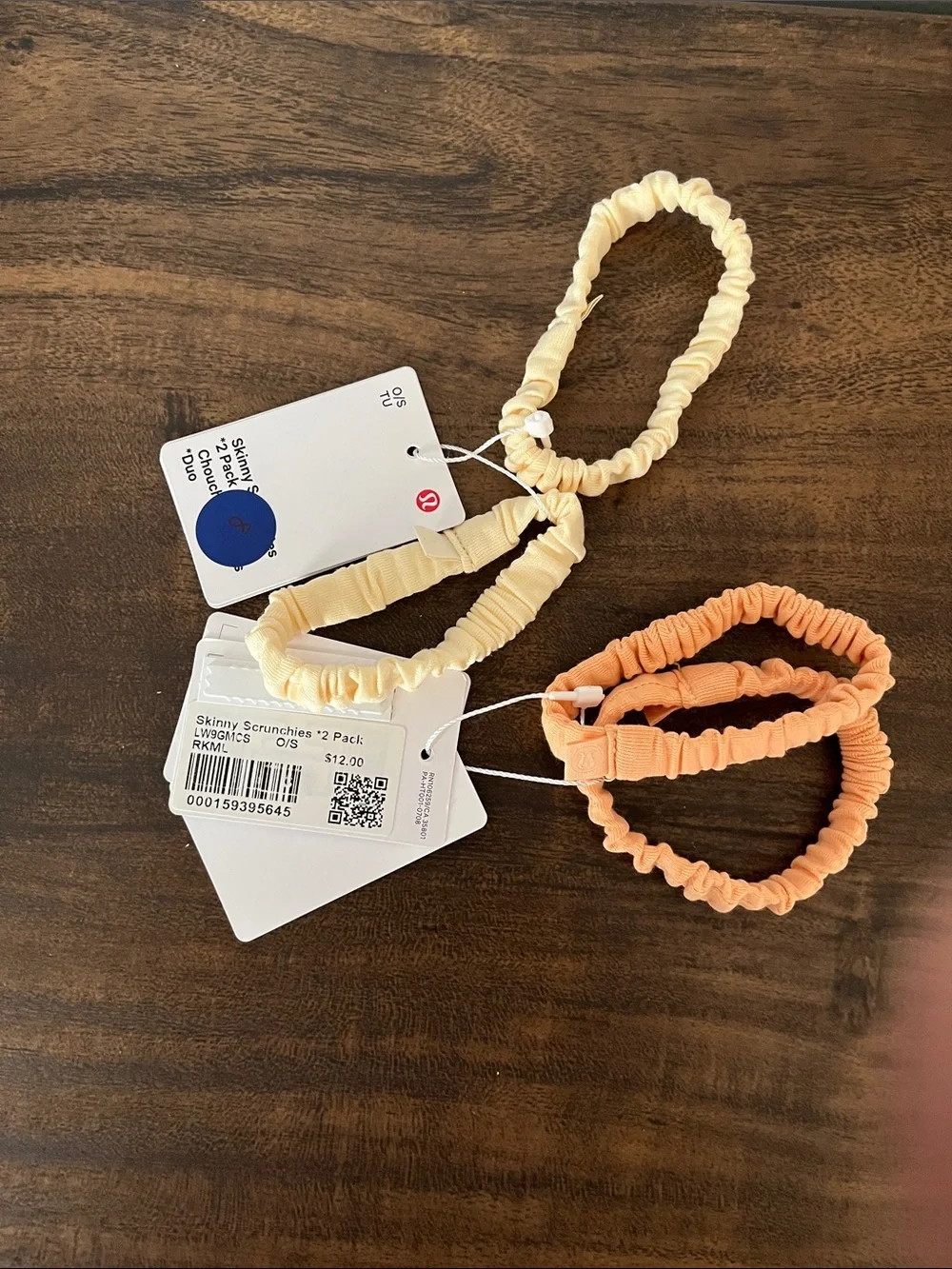 lululemon athletica Skinny Scrunchie Lot in melon and a cream color